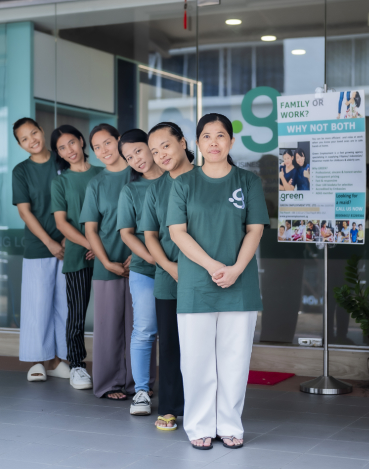 Helpers standing in line outside Green Employment maid agency office