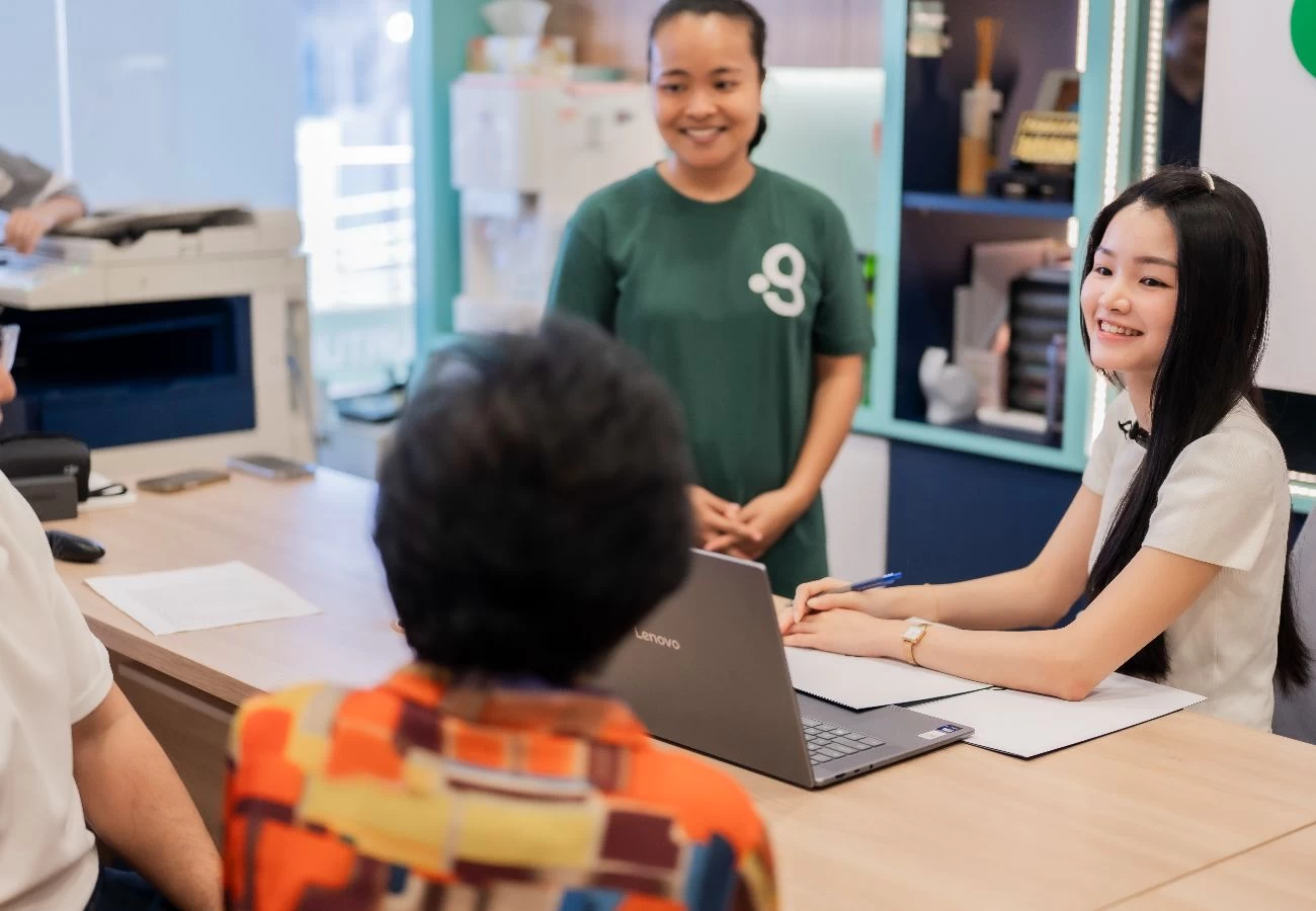 A Green Employment consultant and a domestic helper meets with clients during a maid agency appointment.