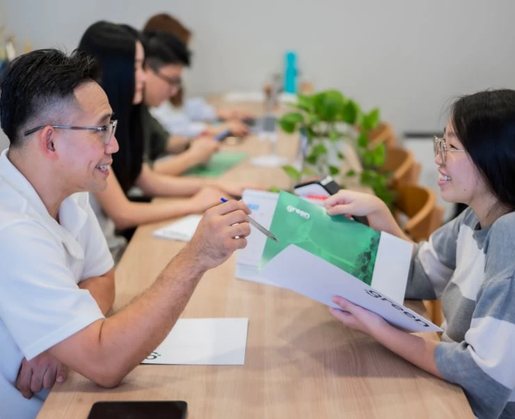 Maid agency consultant discussing helper options with a client